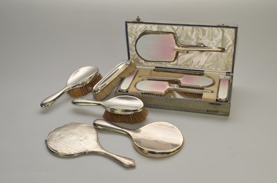 Lot 101 - A cased silver and guilloche enamel dressing table set