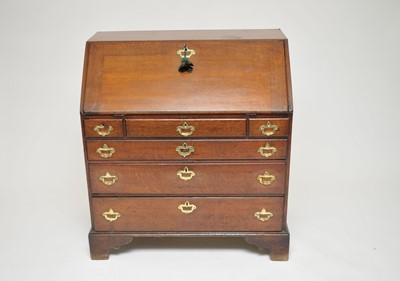 Lot 310 - A 19th century oak bureau, with a fitted...