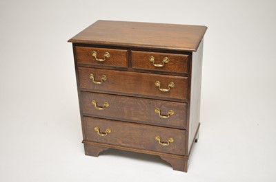 Lot 312 - A reproduction oak chest of two short and...