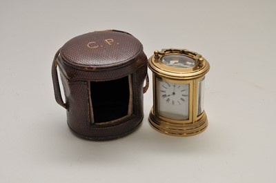Lot 289 - A miniature cased brass carriage clock, of...
