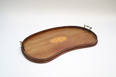 Lot 241 - An Edwardian kidney shaped mahogany drinks...