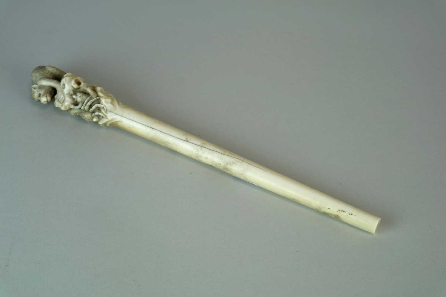 Ivory Staff Lot 223 - A Japanese Meiji period ivory staff, the