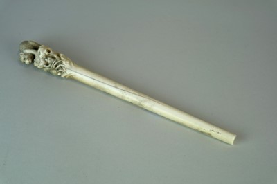 Lot 223 - A Japanese Meiji period ivory staff, the...
