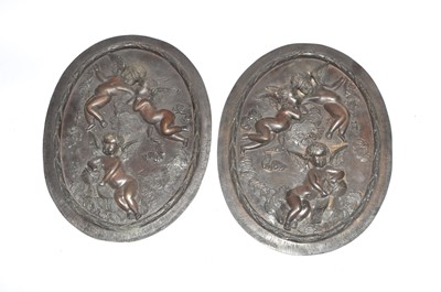 Lot 248 - A pair of cast bronze panels of oval form,...