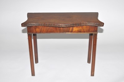 Lot 478 - A 19th century serpentine mahogany card table,...