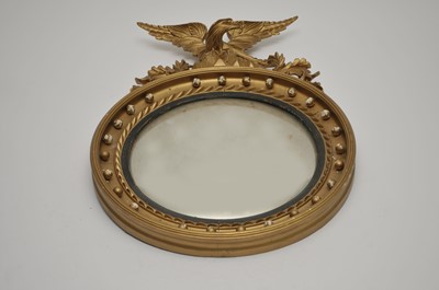 Lot 334 - A Regency style convex wall mirror, with a...