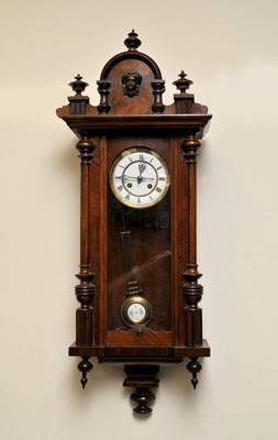Lot 403 - A walnut cased Vienna wall clock with black...