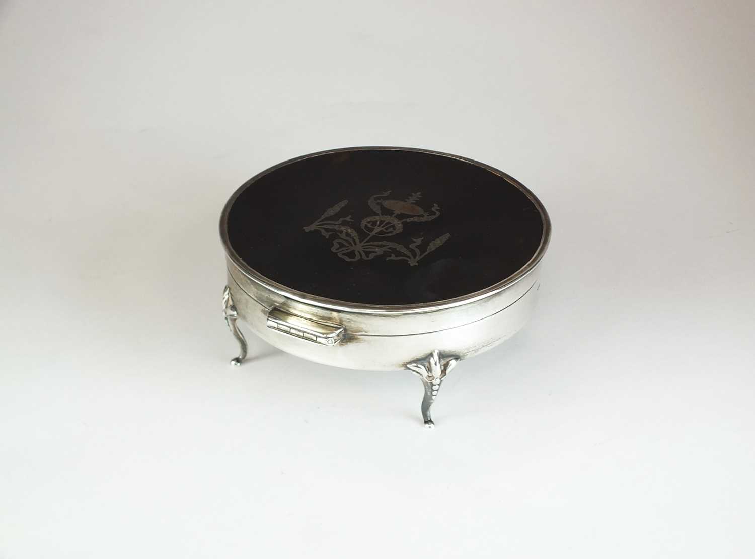 Lot 3 - An early 20th century silver and tortoiseshell mounted dressing table box