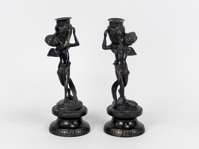 Lot 347 - A pair of bronze figural candlesticks,...