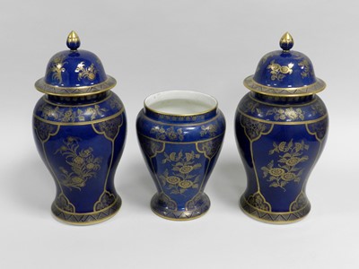 Lot 277 - A garniture of three early 20th century vases