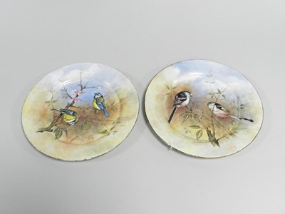 Lot 278 - A pair of plates painted with birds by P.D. English