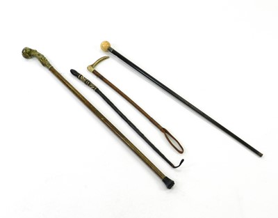 Lot 321 - A group of three walking canes including one...