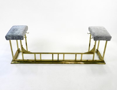 Lot 474 - An Edwardian brass club fender, the two...