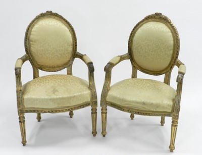 Lot 430 - A pair of Louis XV style carved giltwood open armchairs