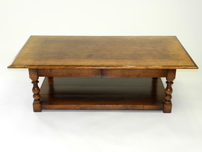 Lot 533 - A late 20th Century oak coffee table, of...