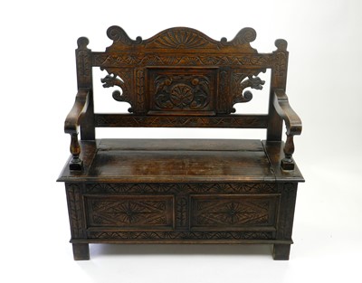 Lot 492 - An Edwardian carved oak monks bench, 107cm...