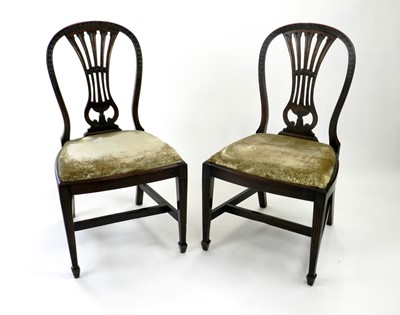 Lot 496 - Four upholstered mahogany side chairs, the...