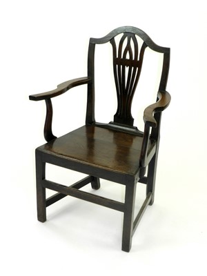 Lot 500 - A 19th century oak open armchair, with vase...