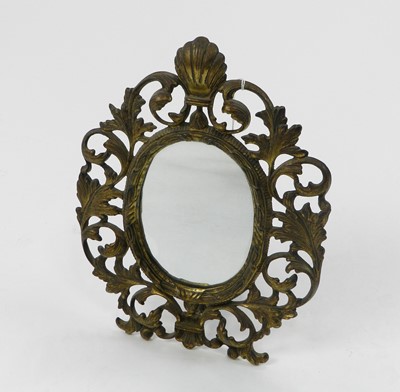 Lot 507 - An Edwardian brass easel back mirror, of oval...