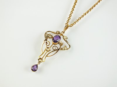 Lot 94 - An early 20th century amethyst and seed pearl pendant on chain