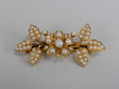 Lot 132 - A seed pearl set bar brooch