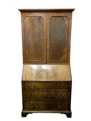 Lot 454 - A George III mahogany bureau bookcase, the...