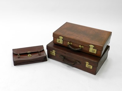 Lot 377 - Two vintage leather suitcases and a leather...