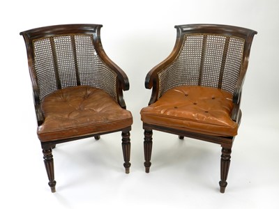 Lot 512 - A pair of Regency style mahogany bergere type...