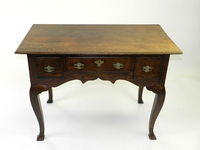 Lot 516 - A reproduction oak lowboy, early 20th Century,...