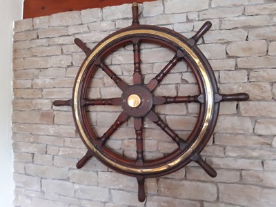 Lot 473 - A brass bound teak ship's wheel, with wall...