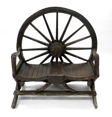 Lot 528 - A wagon wheel backed rustic two-seater garden...