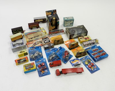 Lot 382 - A quantity of mostly un-boxed diecast vehicles,...