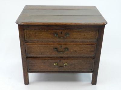 Lot 564 - A 19th century oak chest of three long drawers,...