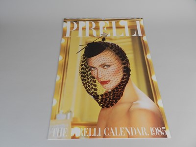 Lot 329 - A collection of twelve Pirelli calendars...