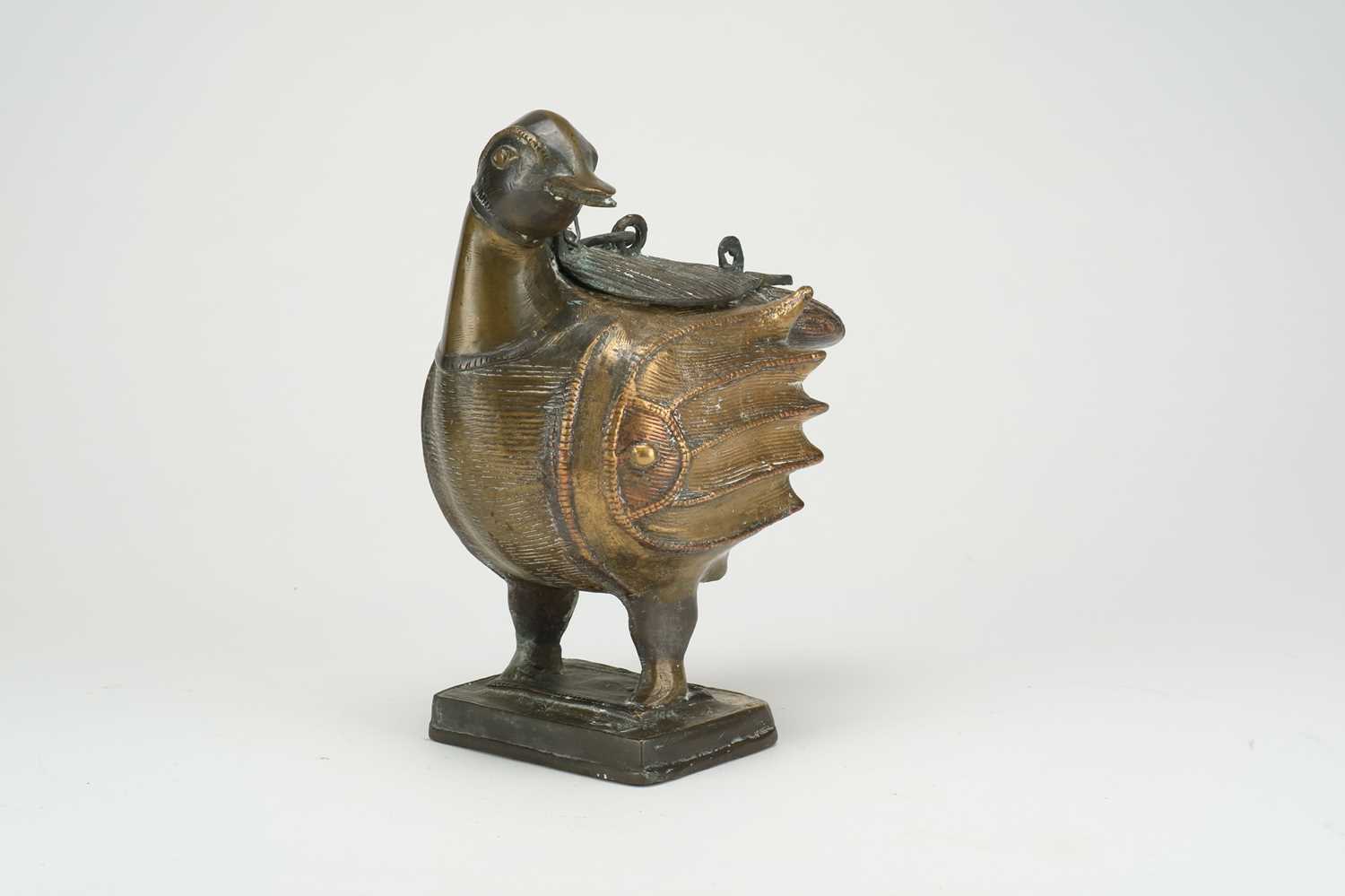 Lot 347 - A Khorasan bronze incense burner in the form of a bird, 19th century