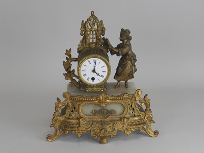 Lot 371 - A French gilt metal and alabaster mantel clock,...