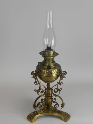 Lot 307 - An Edwardian brass oil lamp, with embossed...