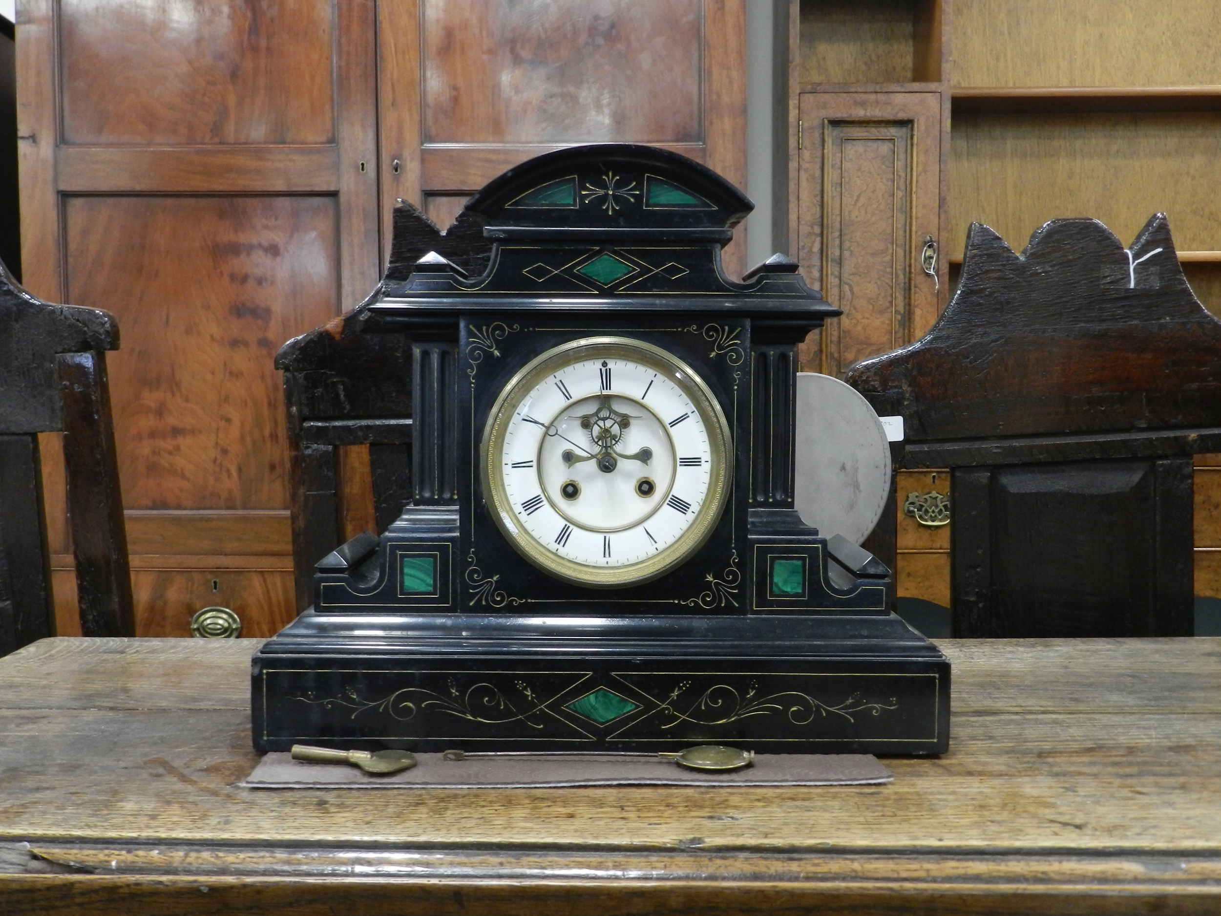 Lot 261 - A French black marble mantel clock, circa