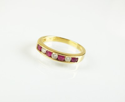 Lot 117 - An 18ct gold seven stone ruby and diamond half eternity ring