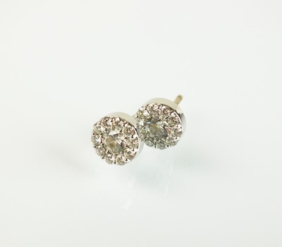 Lot 99 - A pair of diamond stud cluster earrings