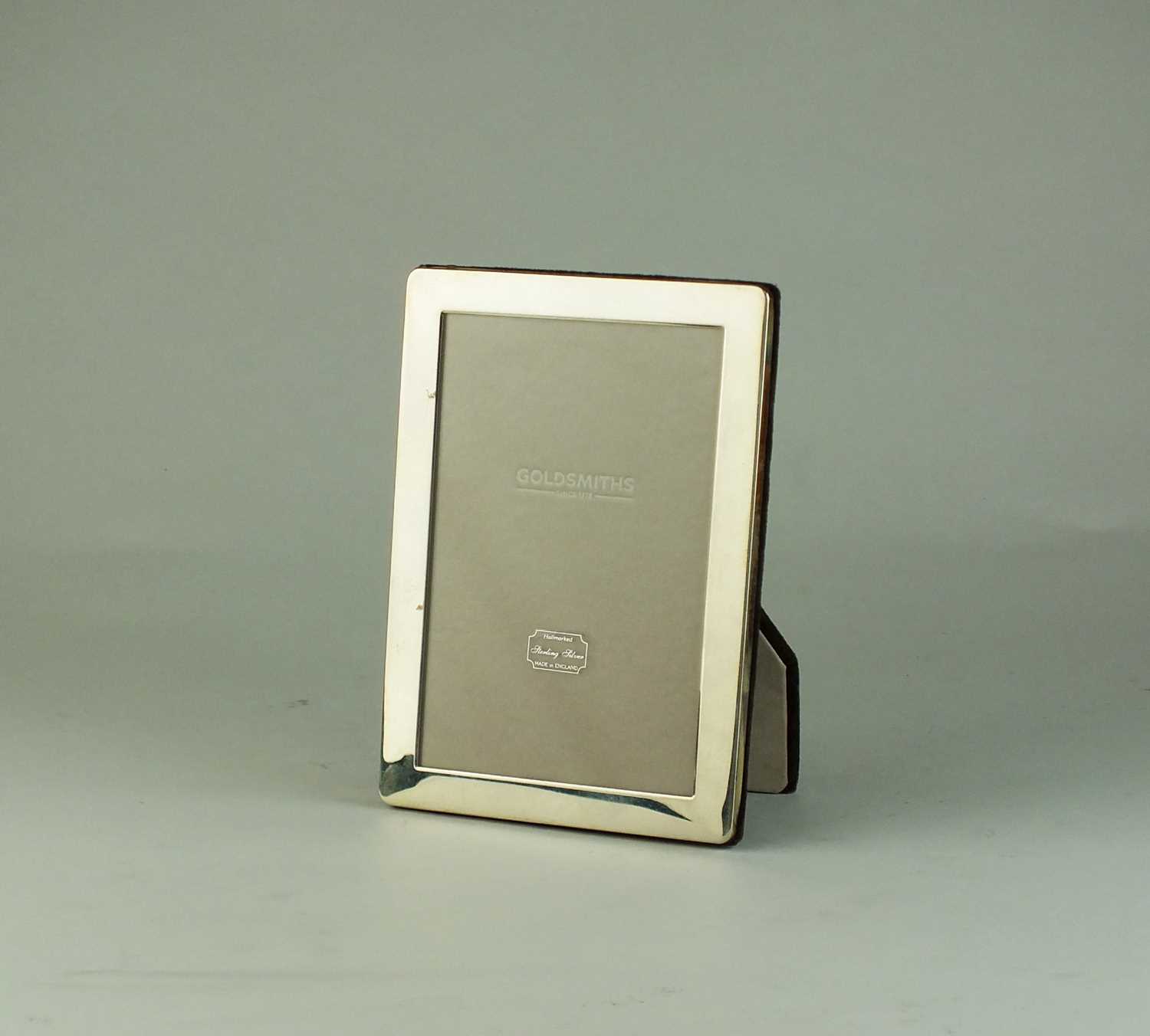 Lot 2 - A Goldsmiths silver mounted rectangular frame