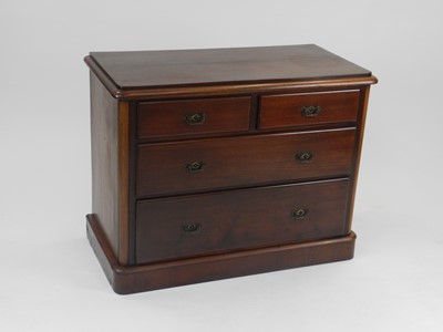 Lot 400 - A stained pine chest of two short over two...