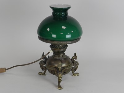 Lot 310 - An Edwardian brass oil lamp, the globular...