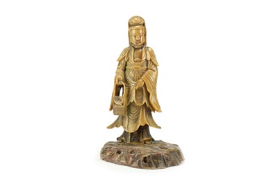 Lot 329 - A Chinese soapstone figure Guanyin, Qing Dynasty