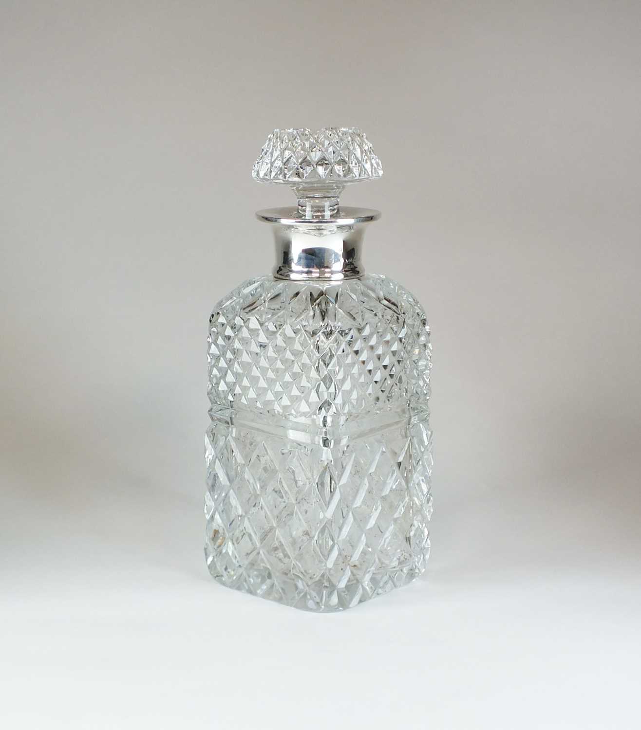 Lot 22 - A silver mounted cut glass decanter