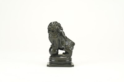 Lot 437 - A Chinese black jade carved lion dog, Qing Dynasty