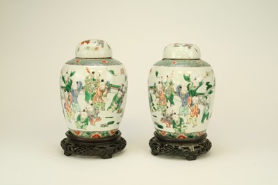 Lot 321 - A pair of Chinese famille verte style jars and covers, Qing Dynasty, 19th century