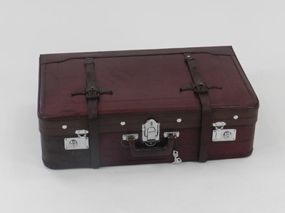 Lot 492 - A recent vintage leather suitcase, in dark red...