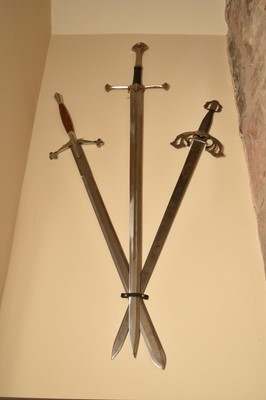 Lot 197 - Three replica two-handed claymore type swords....