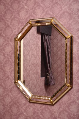 Lot 201 - A reproduction ocatgonal marginal wall mirror,...